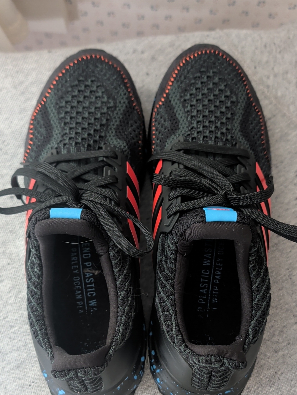 Adidas 6.5" womens, 5.5" mens Ultraboost 5.0 Black Sneakers Orange Accents